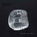 Botella de perfume de vidrio con forma cuadrada transparente con bomba de pulverizador 100ml